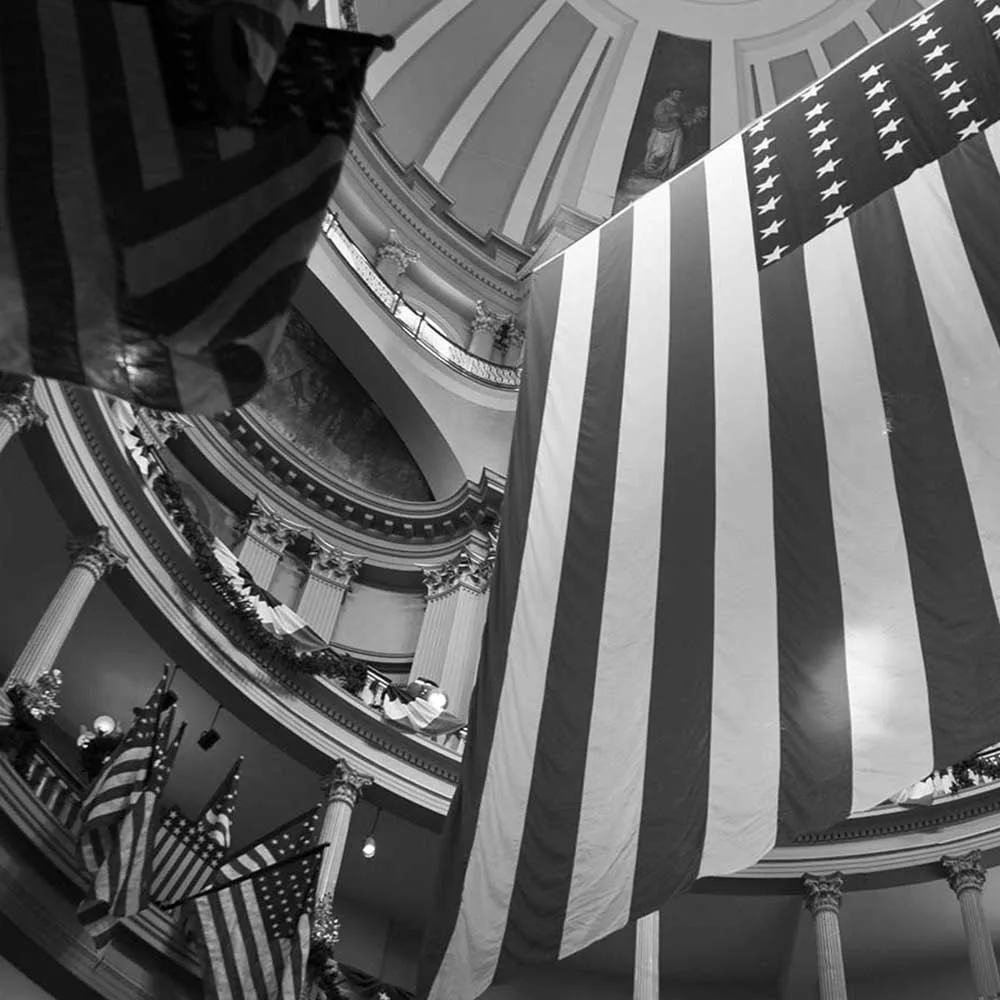 american flag hanging in a court house